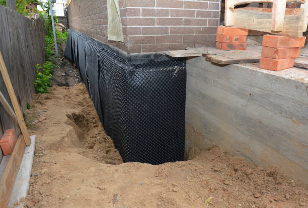 Happy homeowners after waterproofing job in Fond du Lac